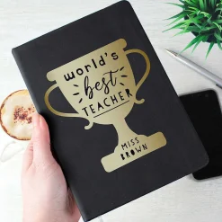 Personalised 'World's Best Teacher' Trophy Black Hardback A5 Notebook>Temptation Gifts Clearance